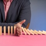 Is Your Salesforce Commerce Cloud Platform Holding You Back? 5 Signs It's Time for a Change_front-commerce_wooden-blocks-falling-representing-slowdown