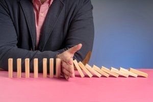 Is Your Salesforce Commerce Cloud Platform Holding You Back? 5 Signs It's Time for a Change_front-commerce_wooden-blocks-falling-representing-slowdown